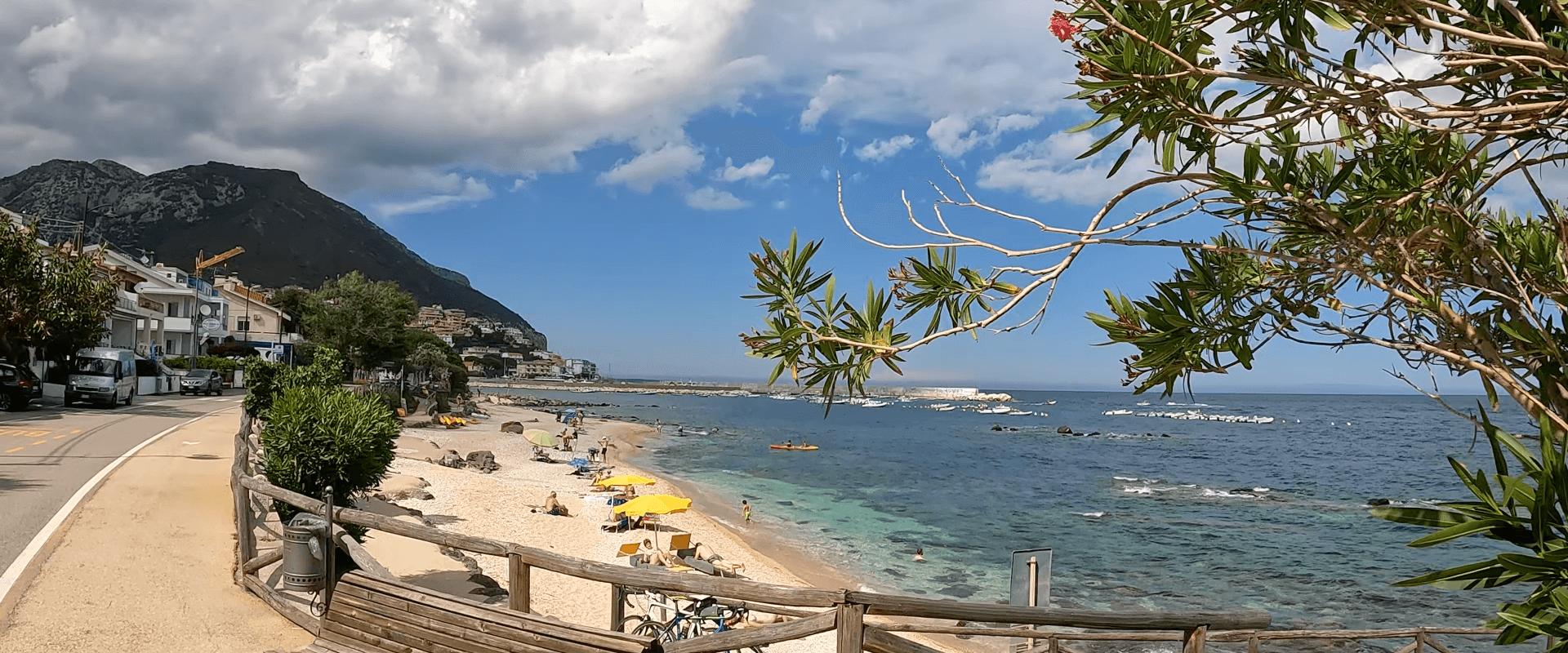 Videos banner image with the seaview with trees, mountains and sandy beach